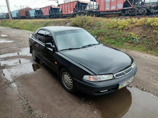 Черный Мазда 626, объемом двигателя 2 л и пробегом 573 тыс. км за 1100 $, фото 1 на Automoto.ua