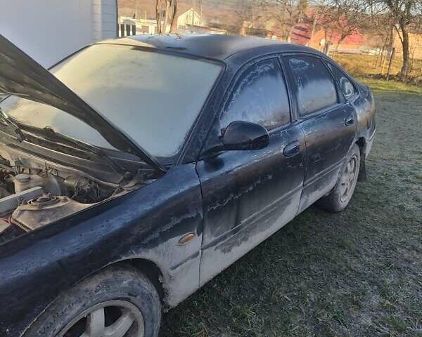 Черный Мазда 626, объемом двигателя 2 л и пробегом 111 тыс. км за 750 $, фото 3 на Automoto.ua