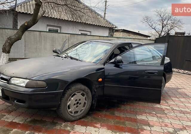 Чорний Мазда 626, об'ємом двигуна 2 л та пробігом 155 тис. км за 1500 $, фото 1 на Automoto.ua