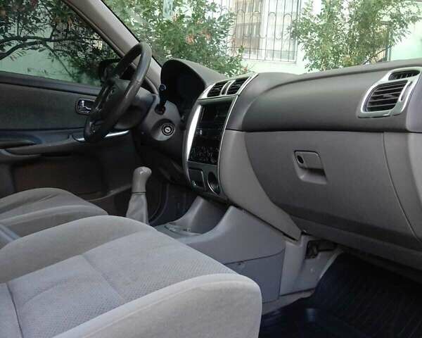 Черный Мазда 626, объемом двигателя 1.8 л и пробегом 316 тыс. км за 2700 $, фото 1 на Automoto.ua