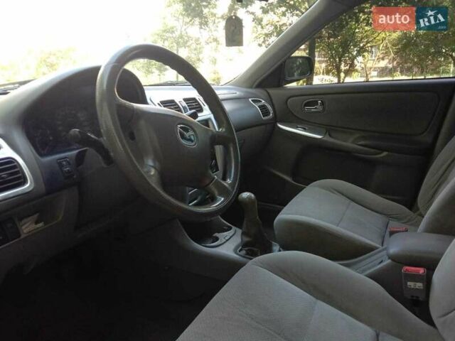 Черный Мазда 626, объемом двигателя 1.8 л и пробегом 316 тыс. км за 2700 $, фото 2 на Automoto.ua