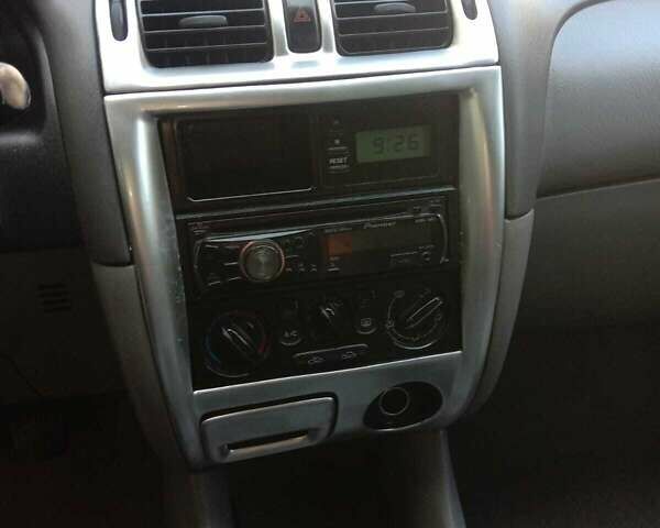 Черный Мазда 626, объемом двигателя 1.8 л и пробегом 316 тыс. км за 2700 $, фото 3 на Automoto.ua