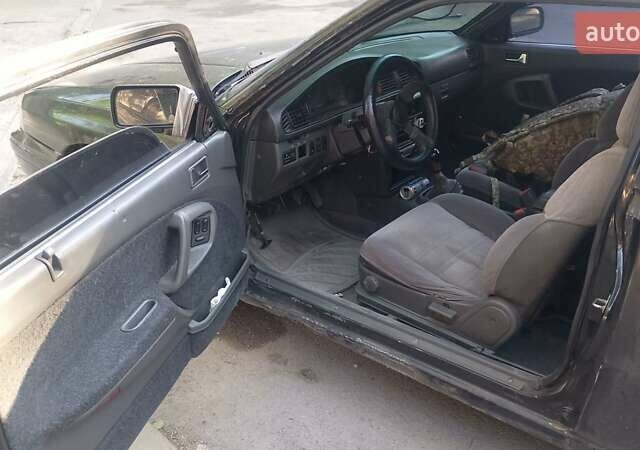 Черный Мазда 626, объемом двигателя 2.2 л и пробегом 400 тыс. км за 1200 $, фото 4 на Automoto.ua