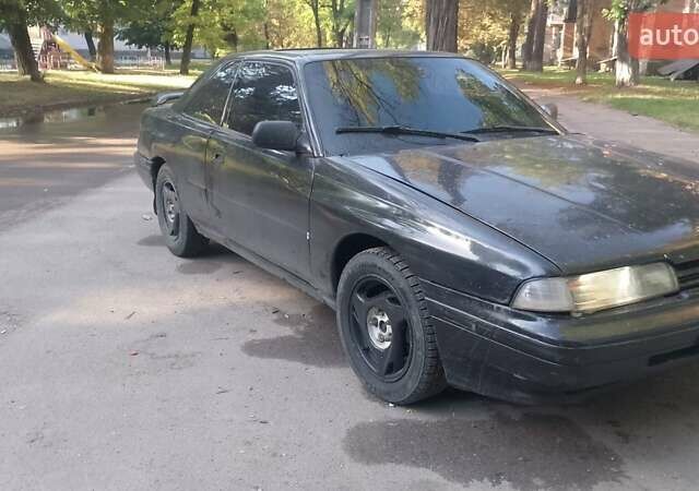 Черный Мазда 626, объемом двигателя 2.2 л и пробегом 400 тыс. км за 1200 $, фото 1 на Automoto.ua