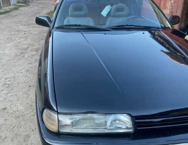 Черный Мазда 626, объемом двигателя 2.2 л и пробегом 280 тыс. км за 1900 $, фото 1 на Automoto.ua