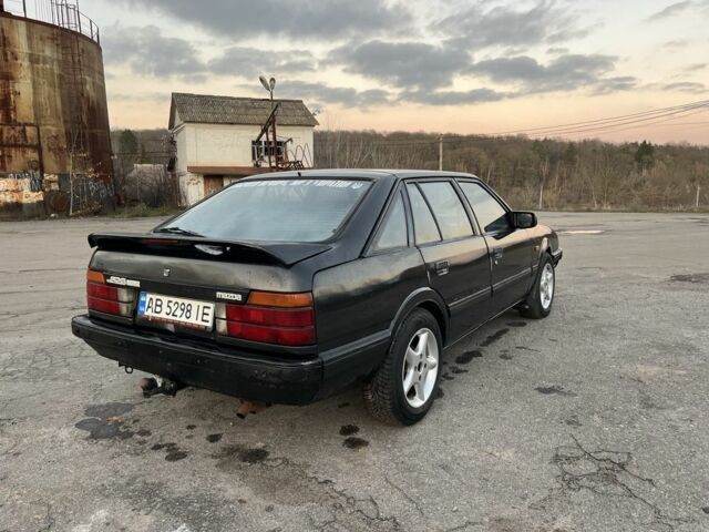 Черный Мазда 626, объемом двигателя 2 л и пробегом 420 тыс. км за 1300 $, фото 3 на Automoto.ua