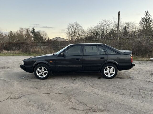 Черный Мазда 626, объемом двигателя 2 л и пробегом 420 тыс. км за 1300 $, фото 1 на Automoto.ua