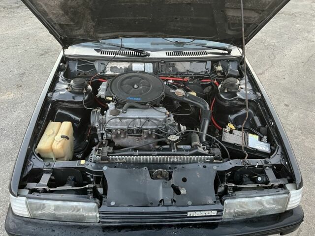 Черный Мазда 626, объемом двигателя 2 л и пробегом 420 тыс. км за 1300 $, фото 7 на Automoto.ua