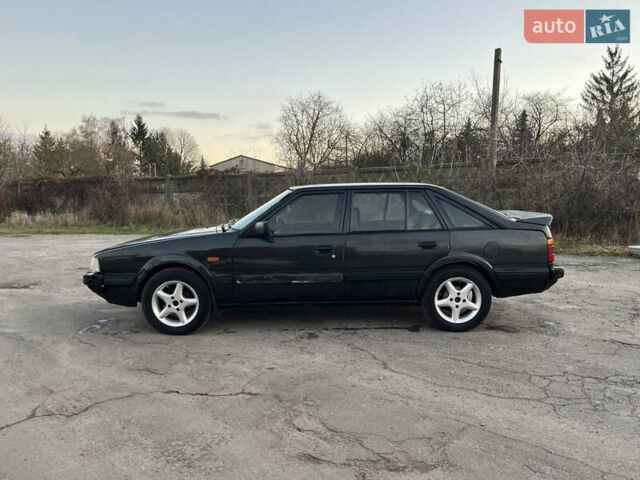 Черный Мазда 626, объемом двигателя 2 л и пробегом 420 тыс. км за 1300 $, фото 2 на Automoto.ua