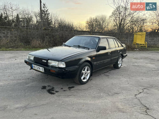 Черный Мазда 626, объемом двигателя 2 л и пробегом 420 тыс. км за 1300 $, фото 1 на Automoto.ua