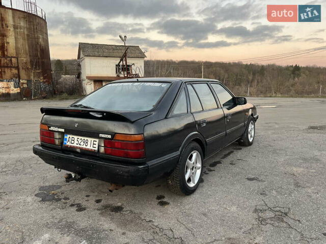 Черный Мазда 626, объемом двигателя 2 л и пробегом 420 тыс. км за 1300 $, фото 4 на Automoto.ua