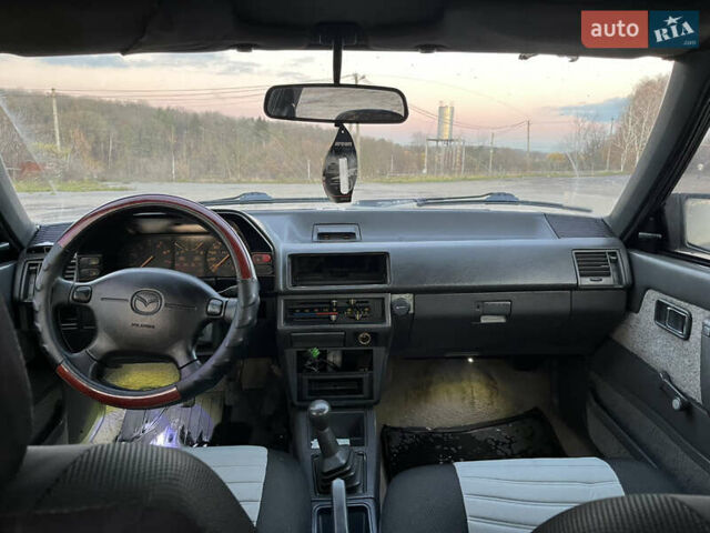 Черный Мазда 626, объемом двигателя 2 л и пробегом 420 тыс. км за 1300 $, фото 7 на Automoto.ua