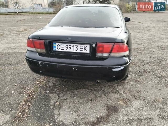 Черный Мазда 626, объемом двигателя 2 л и пробегом 410 тыс. км за 1650 $, фото 5 на Automoto.ua