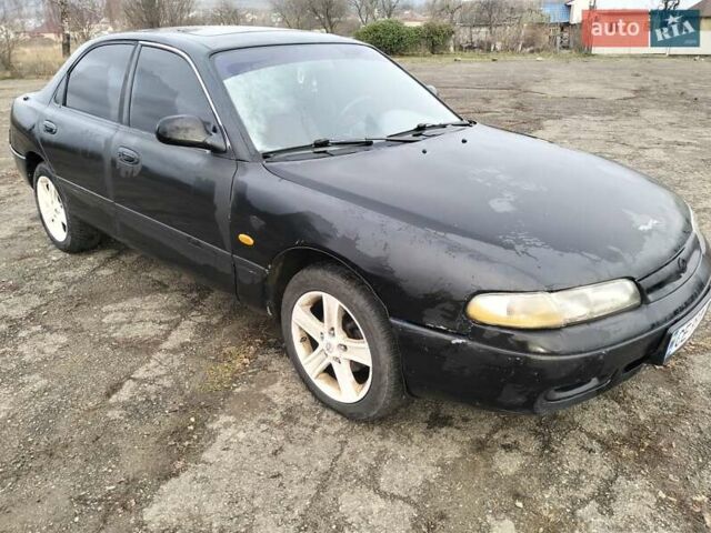 Черный Мазда 626, объемом двигателя 2 л и пробегом 410 тыс. км за 1650 $, фото 1 на Automoto.ua