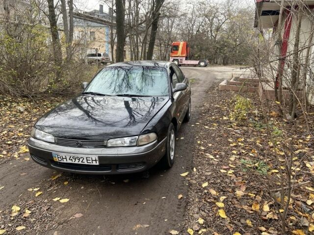 Черный Мазда 626, объемом двигателя 2 л и пробегом 300 тыс. км за 1150 $, фото 5 на Automoto.ua