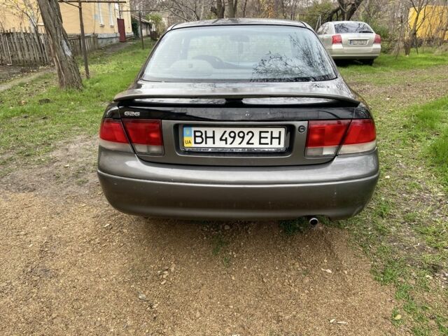 Черный Мазда 626, объемом двигателя 2 л и пробегом 300 тыс. км за 1150 $, фото 20 на Automoto.ua