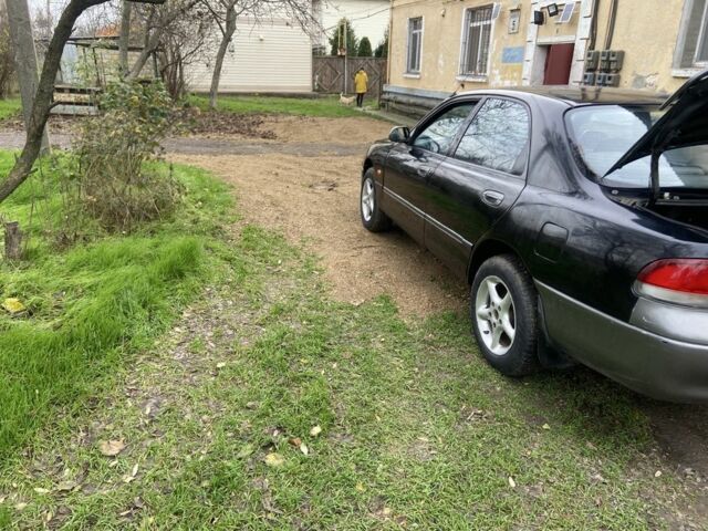 Черный Мазда 626, объемом двигателя 2 л и пробегом 300 тыс. км за 1150 $, фото 17 на Automoto.ua