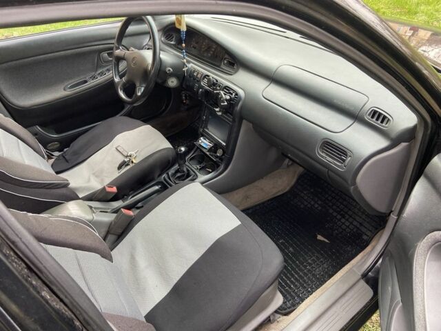 Черный Мазда 626, объемом двигателя 2 л и пробегом 300 тыс. км за 1150 $, фото 22 на Automoto.ua