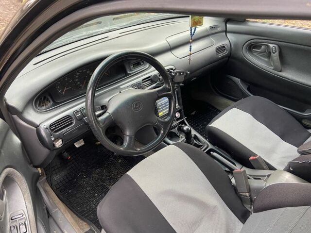 Черный Мазда 626, объемом двигателя 2 л и пробегом 300 тыс. км за 1150 $, фото 3 на Automoto.ua