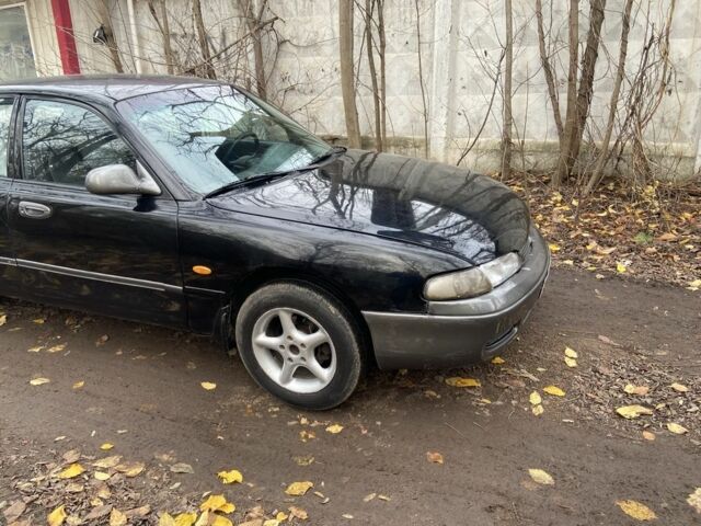 Черный Мазда 626, объемом двигателя 2 л и пробегом 300 тыс. км за 1150 $, фото 12 на Automoto.ua