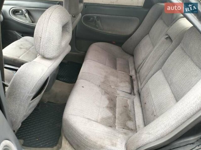 Черный Мазда 626, объемом двигателя 2 л и пробегом 410 тыс. км за 1650 $, фото 10 на Automoto.ua