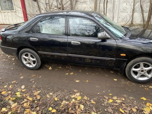 Черный Мазда 626, объемом двигателя 2 л и пробегом 300 тыс. км за 1150 $, фото 10 на Automoto.ua