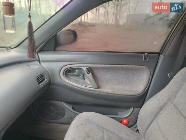 Черный Мазда 626, объемом двигателя 2 л и пробегом 410 тыс. км за 1650 $, фото 12 на Automoto.ua