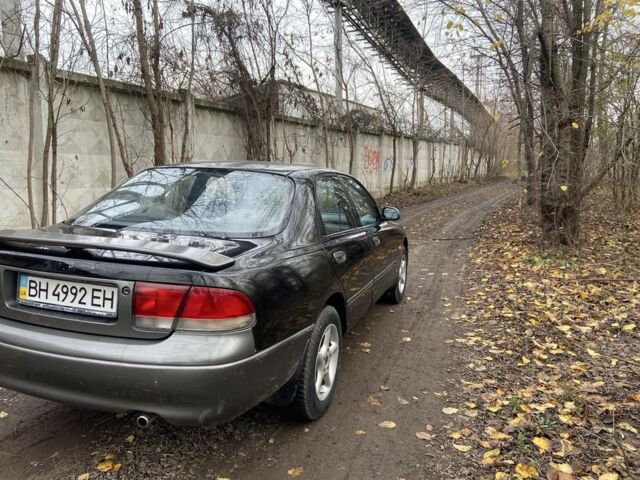 Черный Мазда 626, объемом двигателя 2 л и пробегом 300 тыс. км за 1150 $, фото 7 на Automoto.ua