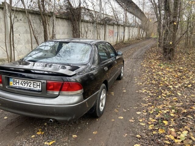 Черный Мазда 626, объемом двигателя 2 л и пробегом 300 тыс. км за 1150 $, фото 14 на Automoto.ua