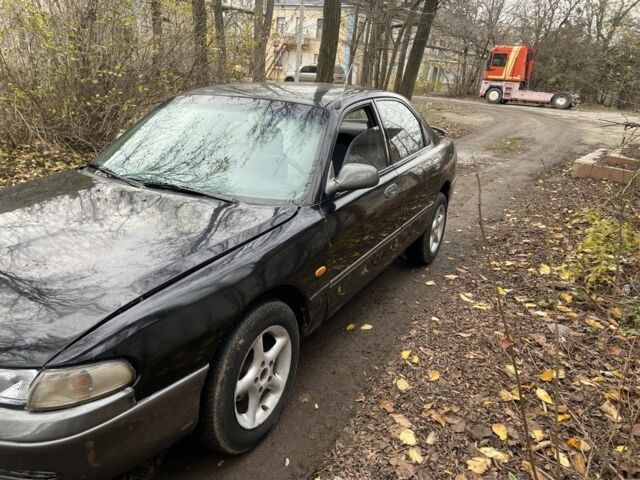 Черный Мазда 626, объемом двигателя 2 л и пробегом 300 тыс. км за 1150 $, фото 4 на Automoto.ua