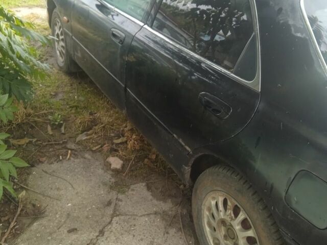 Черный Мазда 626, объемом двигателя 0 л и пробегом 300 тыс. км за 1069 $, фото 1 на Automoto.ua