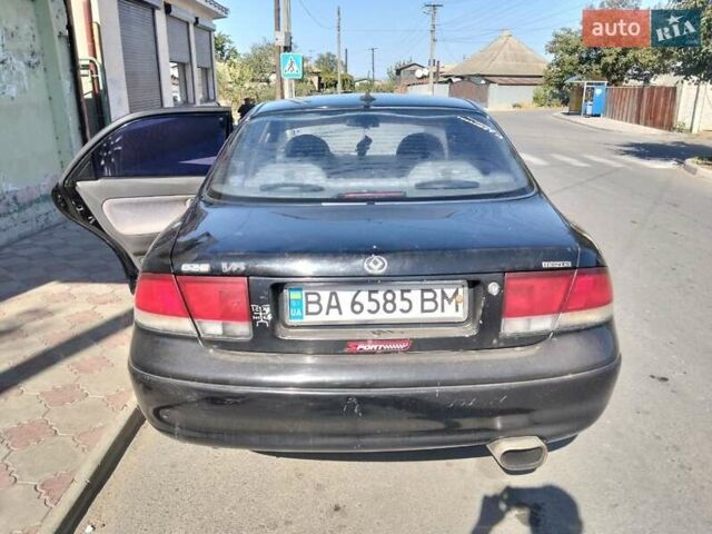 Чорний Мазда 626, об'ємом двигуна 2 л та пробігом 200 тис. км за 1700 $, фото 3 на Automoto.ua