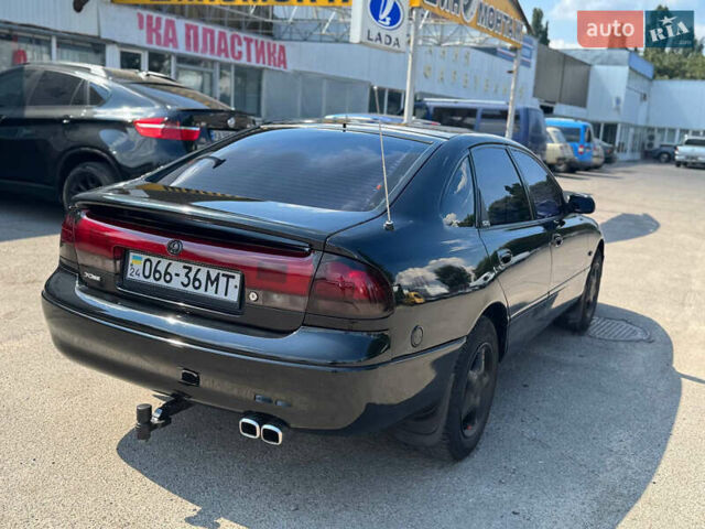 Черный Мазда 626, объемом двигателя 1.79 л и пробегом 310 тыс. км за 2999 $, фото 3 на Automoto.ua