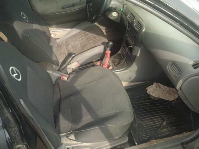 Черный Мазда 626, объемом двигателя 0 л и пробегом 300 тыс. км за 1069 $, фото 4 на Automoto.ua