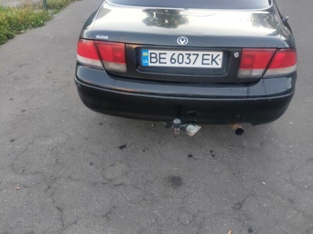 Черный Мазда 626, объемом двигателя 1.8 л и пробегом 101 тыс. км за 1500 $, фото 2 на Automoto.ua