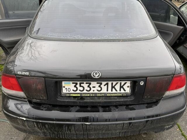 Черный Мазда 626, объемом двигателя 1.8 л и пробегом 390 тыс. км за 993 $, фото 2 на Automoto.ua