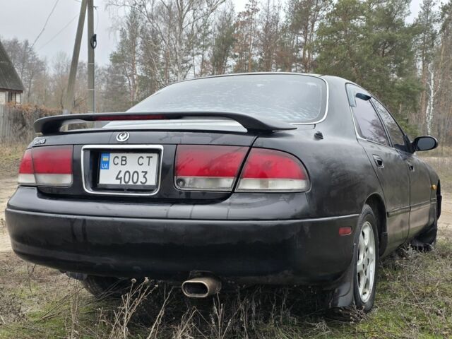 Черный Мазда 626, объемом двигателя 2 л и пробегом 250 тыс. км за 1500 $, фото 3 на Automoto.ua