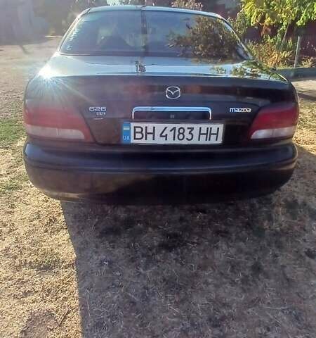 Черный Мазда 626, объемом двигателя 2 л и пробегом 219 тыс. км за 2800 $, фото 1 на Automoto.ua