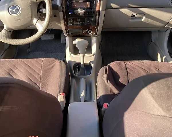 Черный Мазда 626, объемом двигателя 2 л и пробегом 210 тыс. км за 3000 $, фото 7 на Automoto.ua