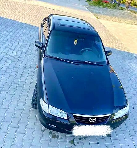 Черный Мазда 626, объемом двигателя 2 л и пробегом 208 тыс. км за 3000 $, фото 1 на Automoto.ua