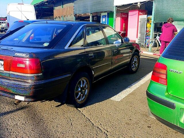 Черный Мазда 626, объемом двигателя 2 л и пробегом 300 тыс. км за 1100 $, фото 2 на Automoto.ua