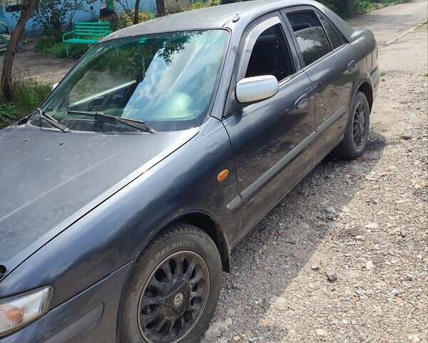 Фиолетовый Мазда 626, объемом двигателя 2 л и пробегом 320 тыс. км за 1200 $, фото 1 на Automoto.ua