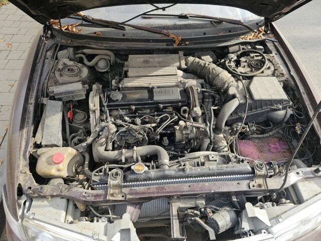 Коричневый Мазда 626, объемом двигателя 2 л и пробегом 290 тыс. км за 1150 $, фото 1 на Automoto.ua