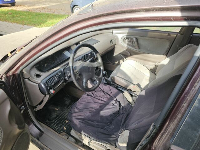 Коричневый Мазда 626, объемом двигателя 2 л и пробегом 290 тыс. км за 1150 $, фото 4 на Automoto.ua