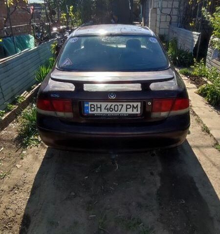 Коричневый Мазда 626, объемом двигателя 1.8 л и пробегом 200 тыс. км за 1161 $, фото 2 на Automoto.ua