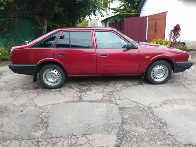 Красный Мазда 626, объемом двигателя 2 л и пробегом 250 тыс. км за 1212 $, фото 2 на Automoto.ua