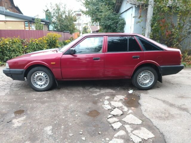 Красный Мазда 626, объемом двигателя 2 л и пробегом 250 тыс. км за 1212 $, фото 3 на Automoto.ua