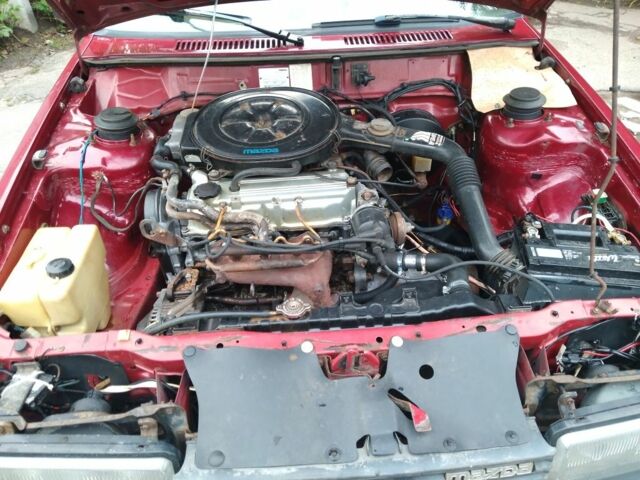 Красный Мазда 626, объемом двигателя 2 л и пробегом 250 тыс. км за 1212 $, фото 4 на Automoto.ua