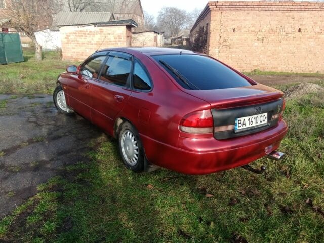 Красный Мазда 626, объемом двигателя 2 л и пробегом 350 тыс. км за 1999 $, фото 1 на Automoto.ua