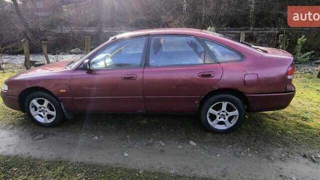 Красный Мазда 626, объемом двигателя 1.8 л и пробегом 219 тыс. км за 1700 $, фото 1 на Automoto.ua